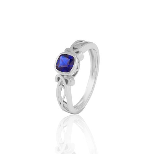 Blue Cushion-Cut Stone Ring with Intricate Openwork Design