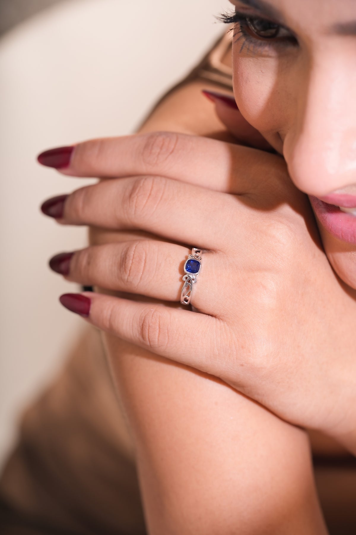 Blue Cushion-Cut Stone Ring with Intricate Openwork Design