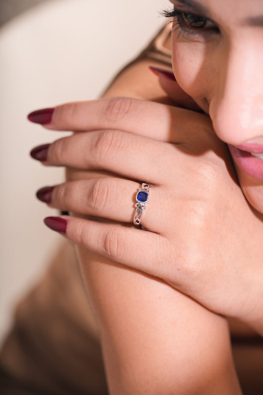 Blue Cushion-Cut Stone Ring with Intricate Openwork Design