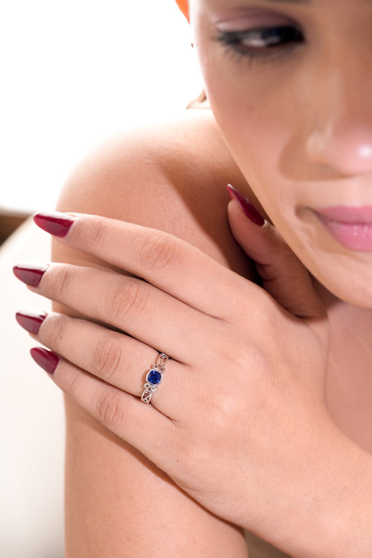 Blue Cushion-Cut Stone Ring with Intricate Openwork Design