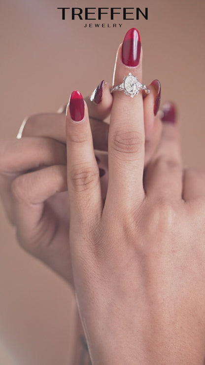 Oval Solitaire Ring with Intricate Side Detailing