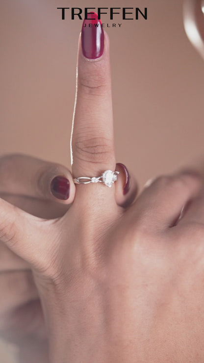 Pear Solitaire Ring with Sparkling Side Stones