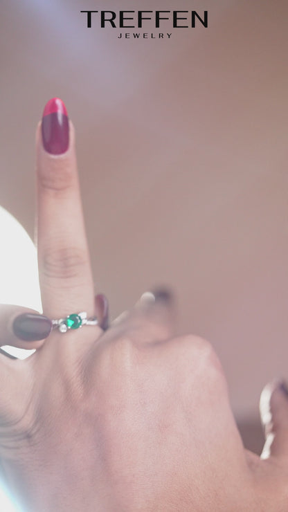 Emerald Green Oval Stone Ring with Sparkling Side Details