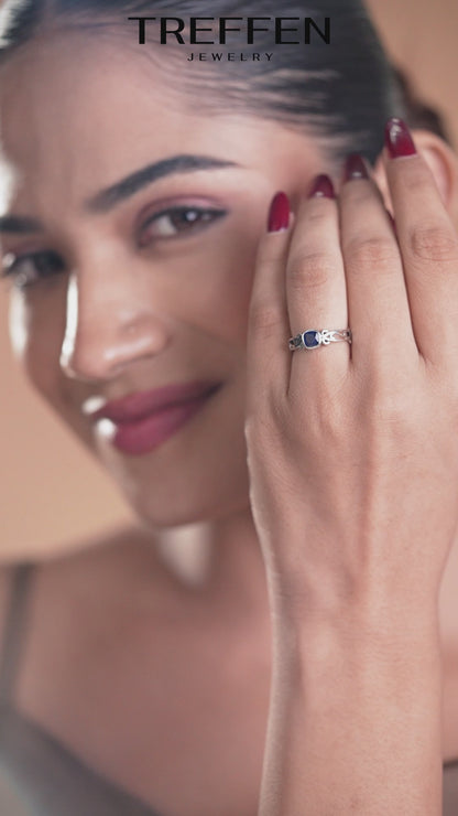 Blue Cushion-Cut Stone Ring with Intricate Openwork Design